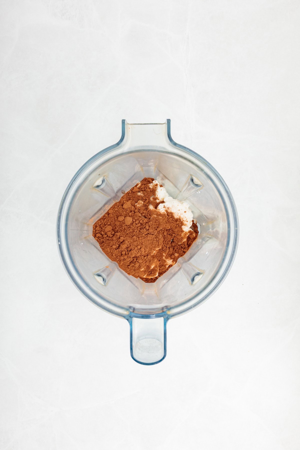 Cheese, cocoa and vanilla in a blender. 