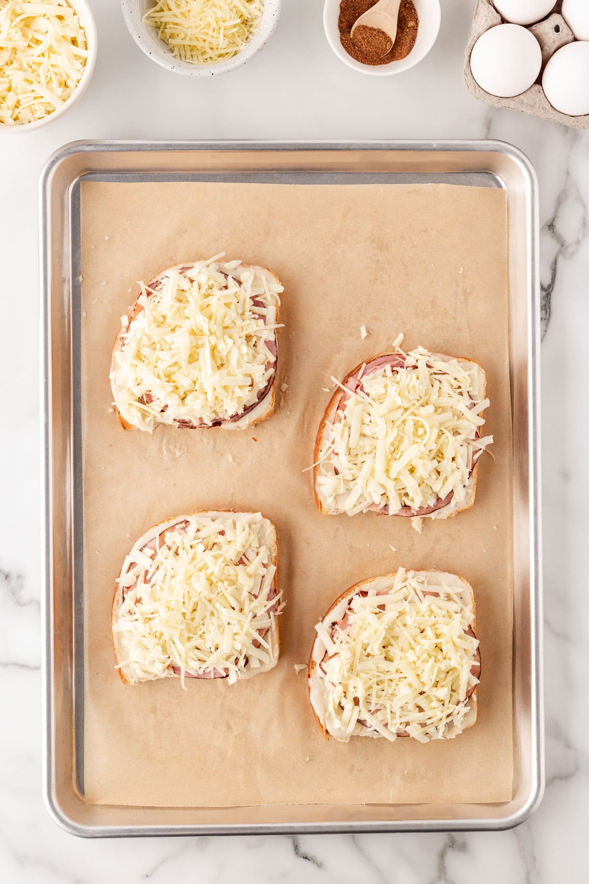 Adding grated cheese. 