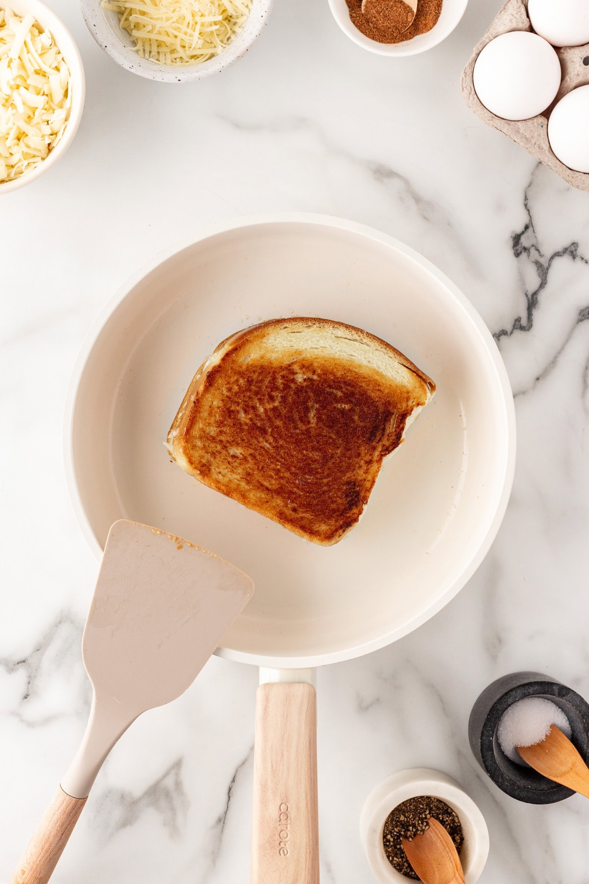Toasting the sandwich in a pan. 