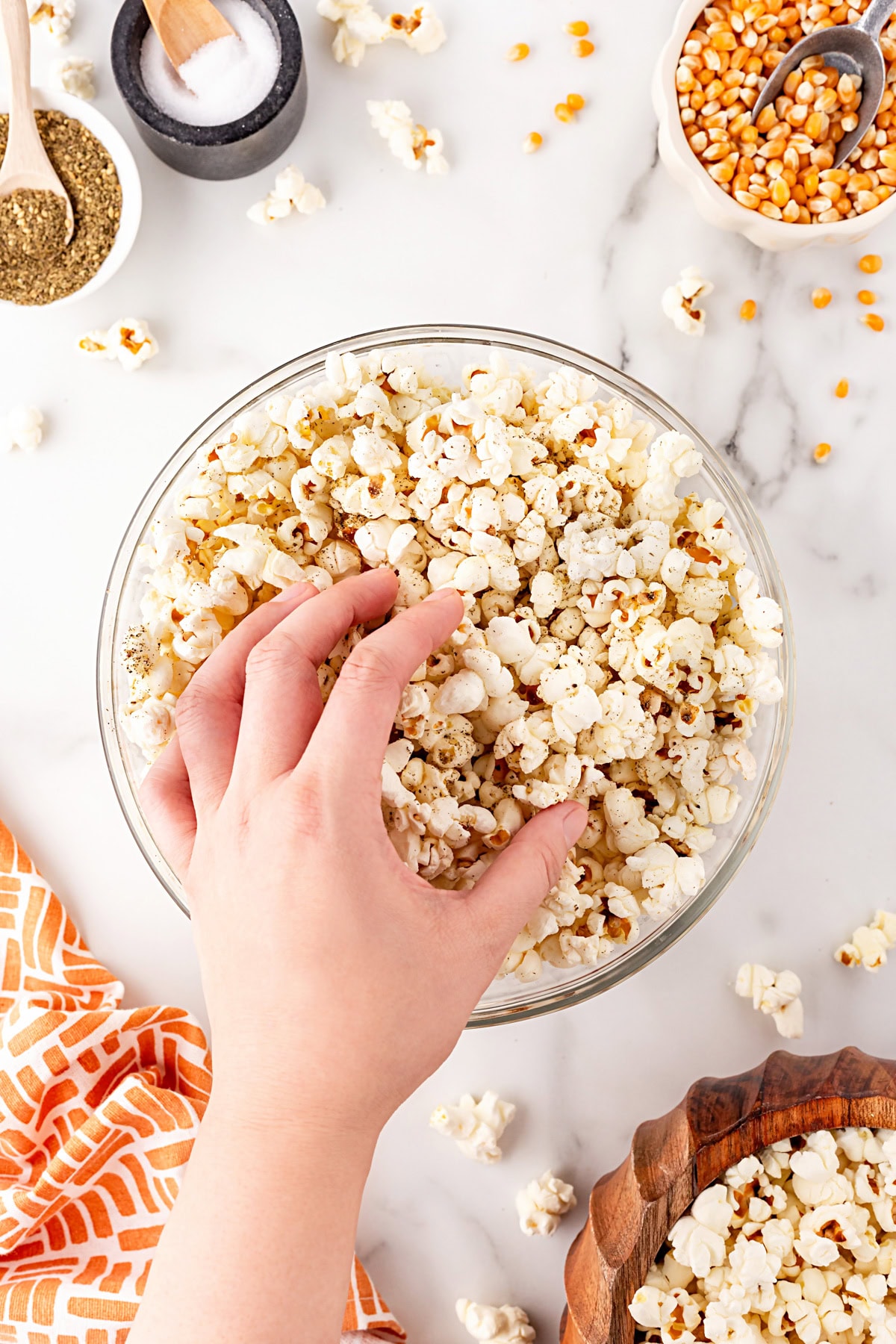 Grabbing a handful of popcorn. 