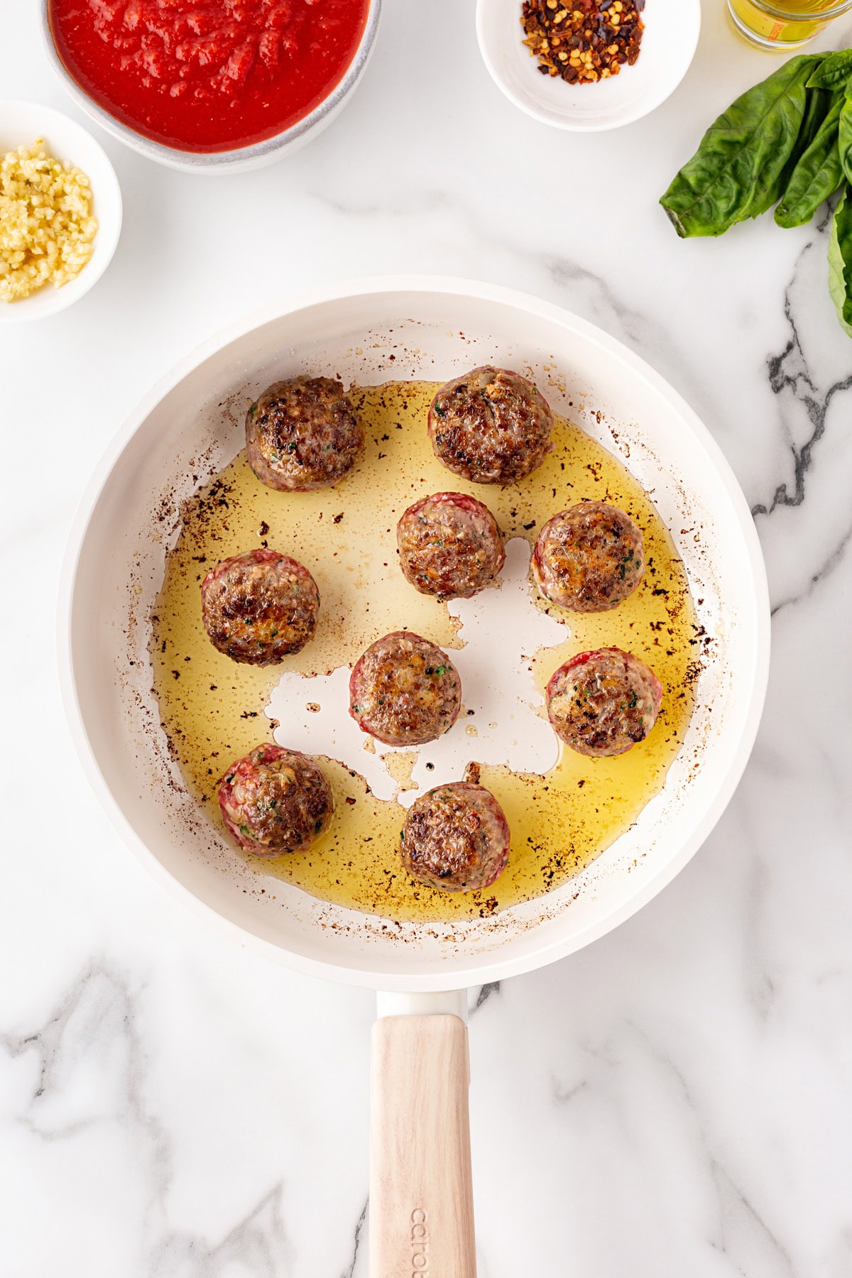Turned meatballs over while cooking. 