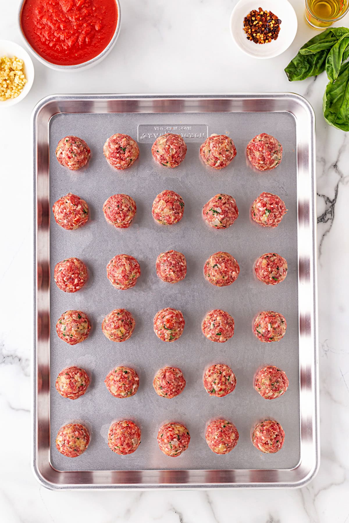 Meatballs on a baking sheet. 