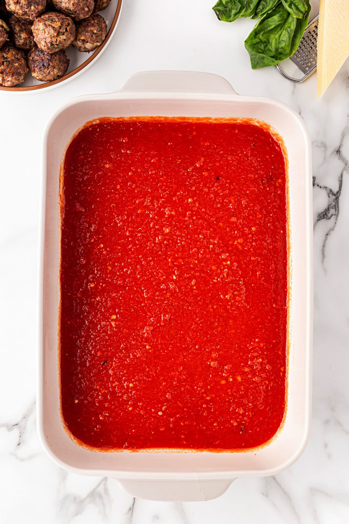 Some sauce in baking pan. 