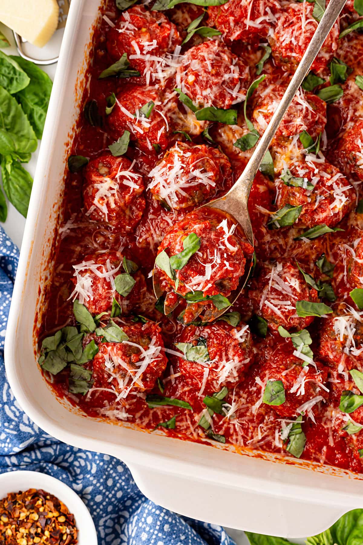 Spooning out a meatball. 