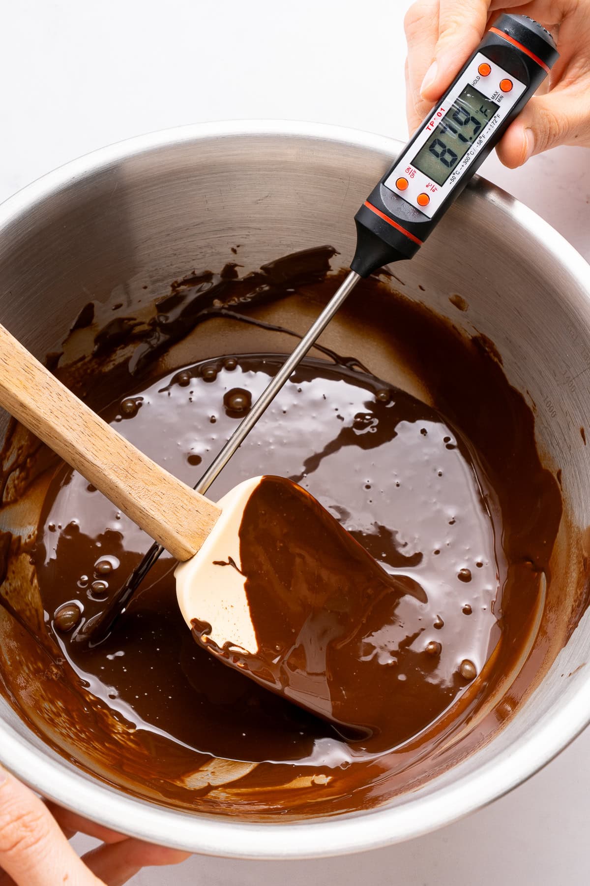 Measuring chocolate temperature.