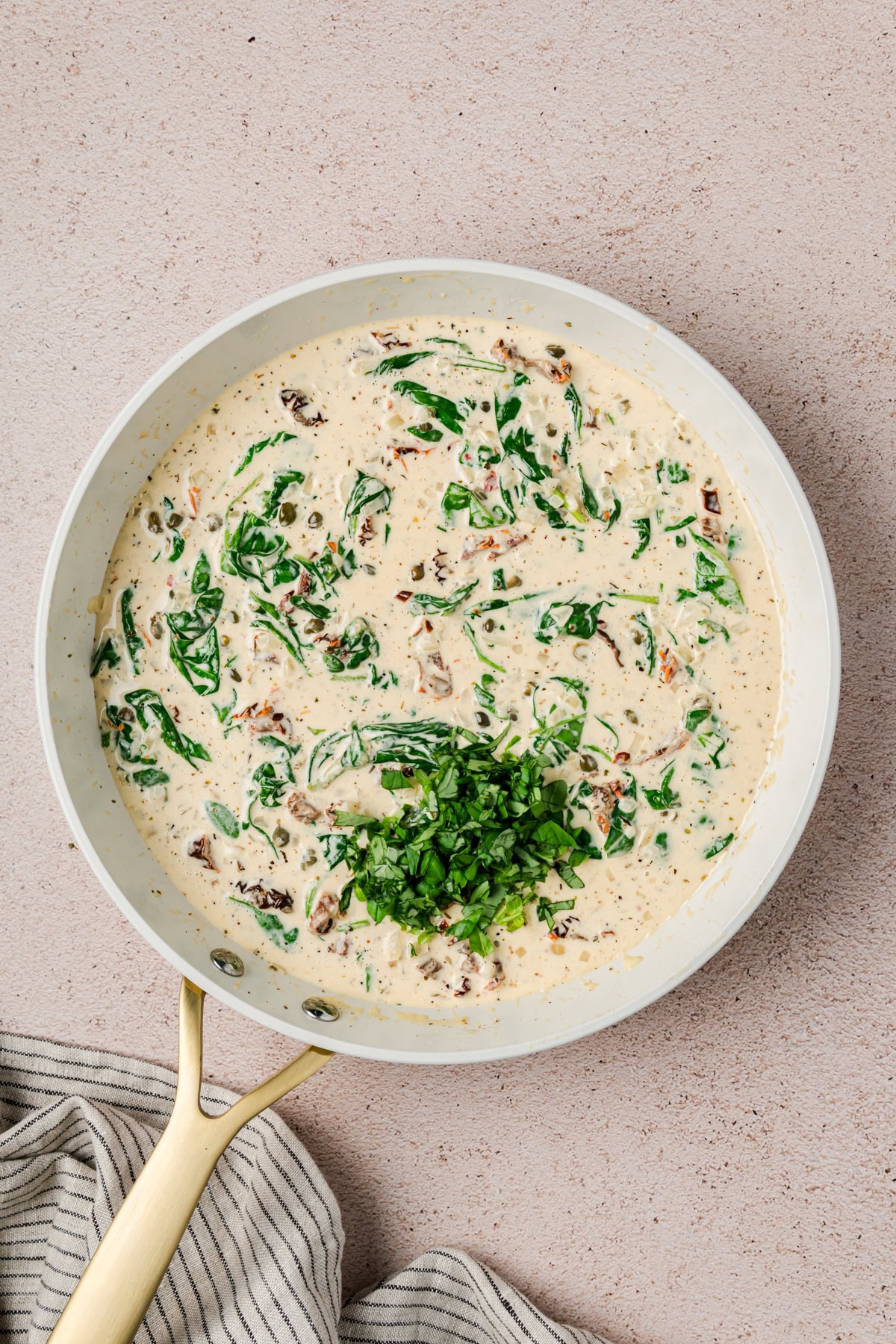 Adding in chopped basil. 