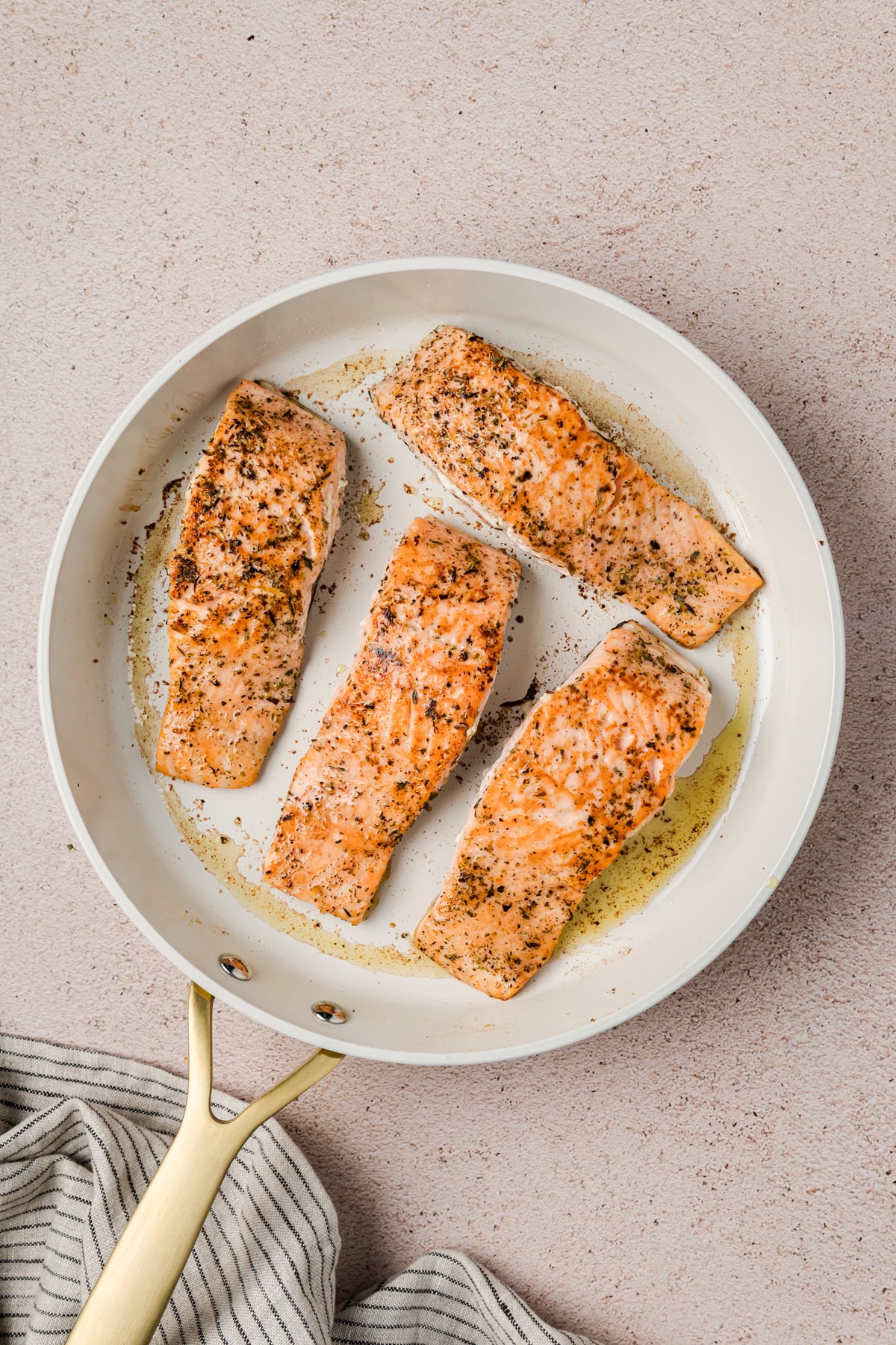 Cooking the skin side of the salmon. 