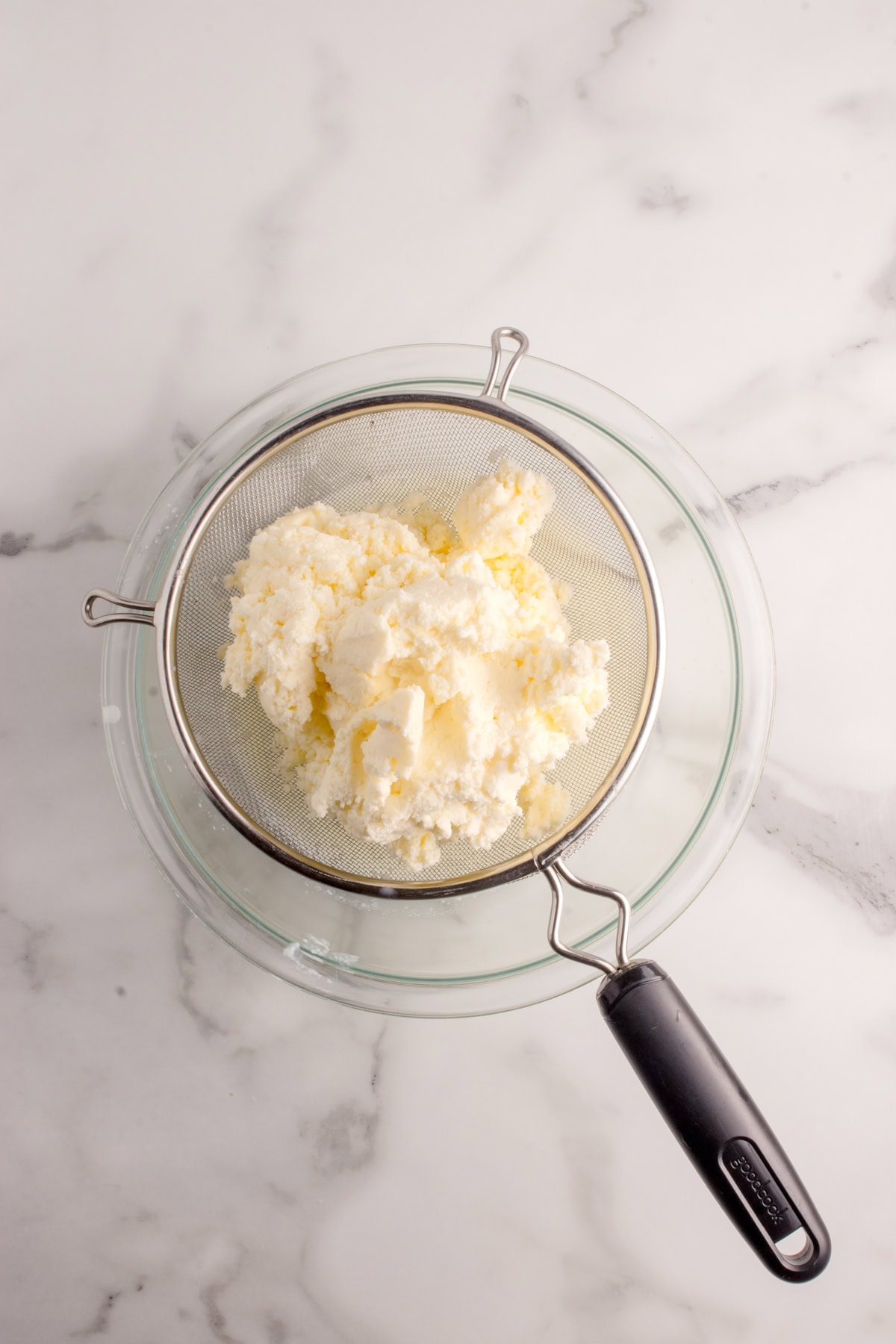 Butter in strainer.