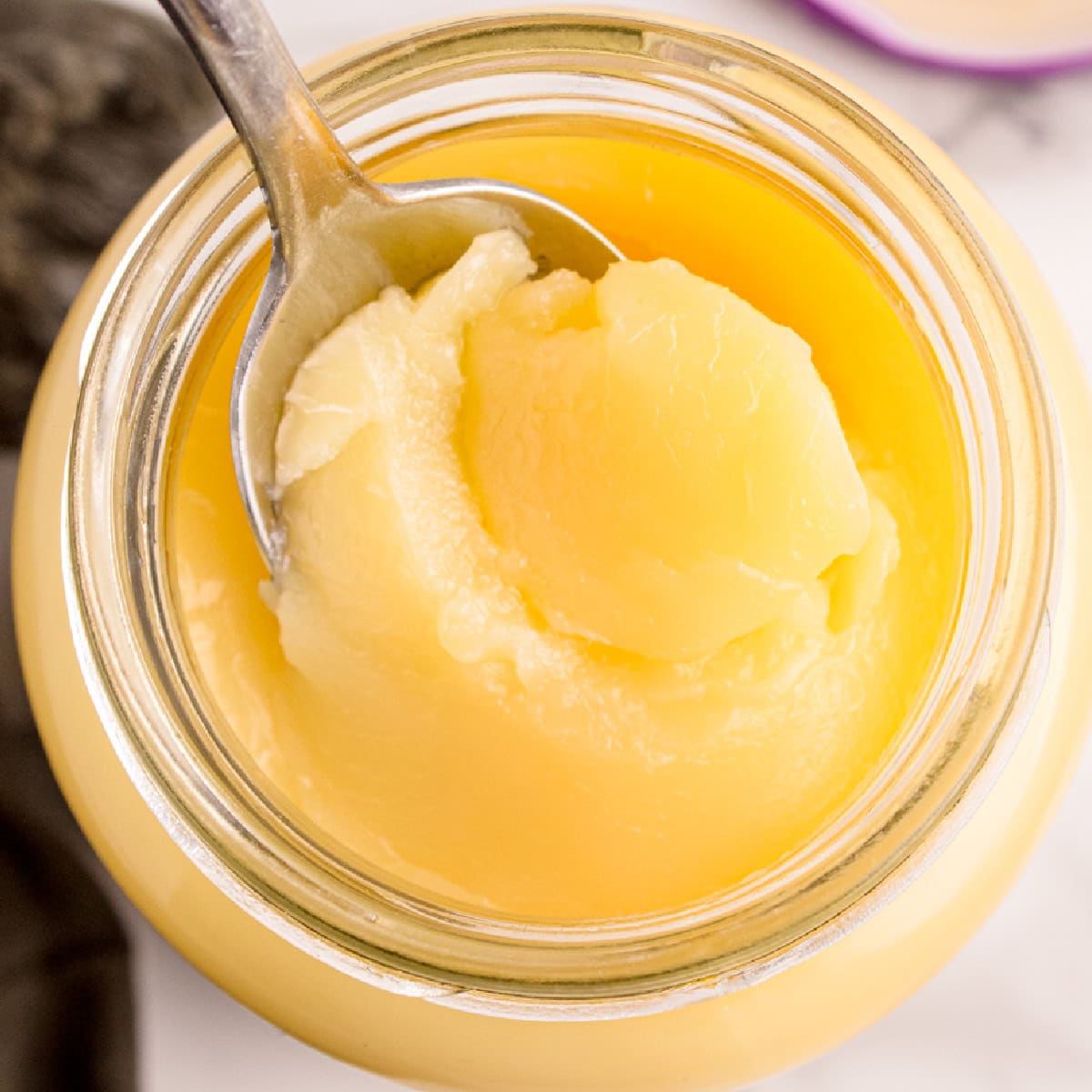 Overhead spooning out ghee.