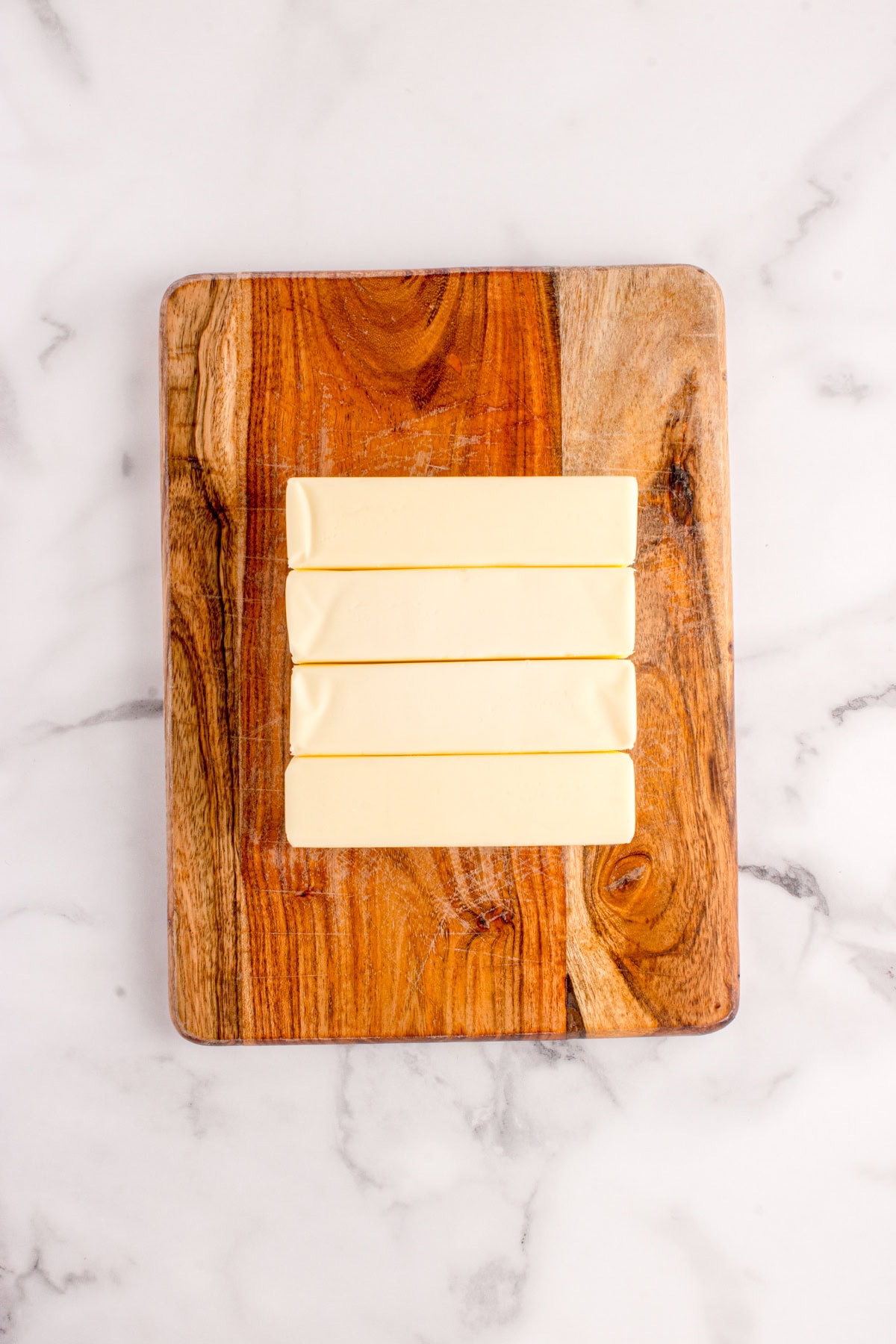 How to Make Ghee - butter on a board. 