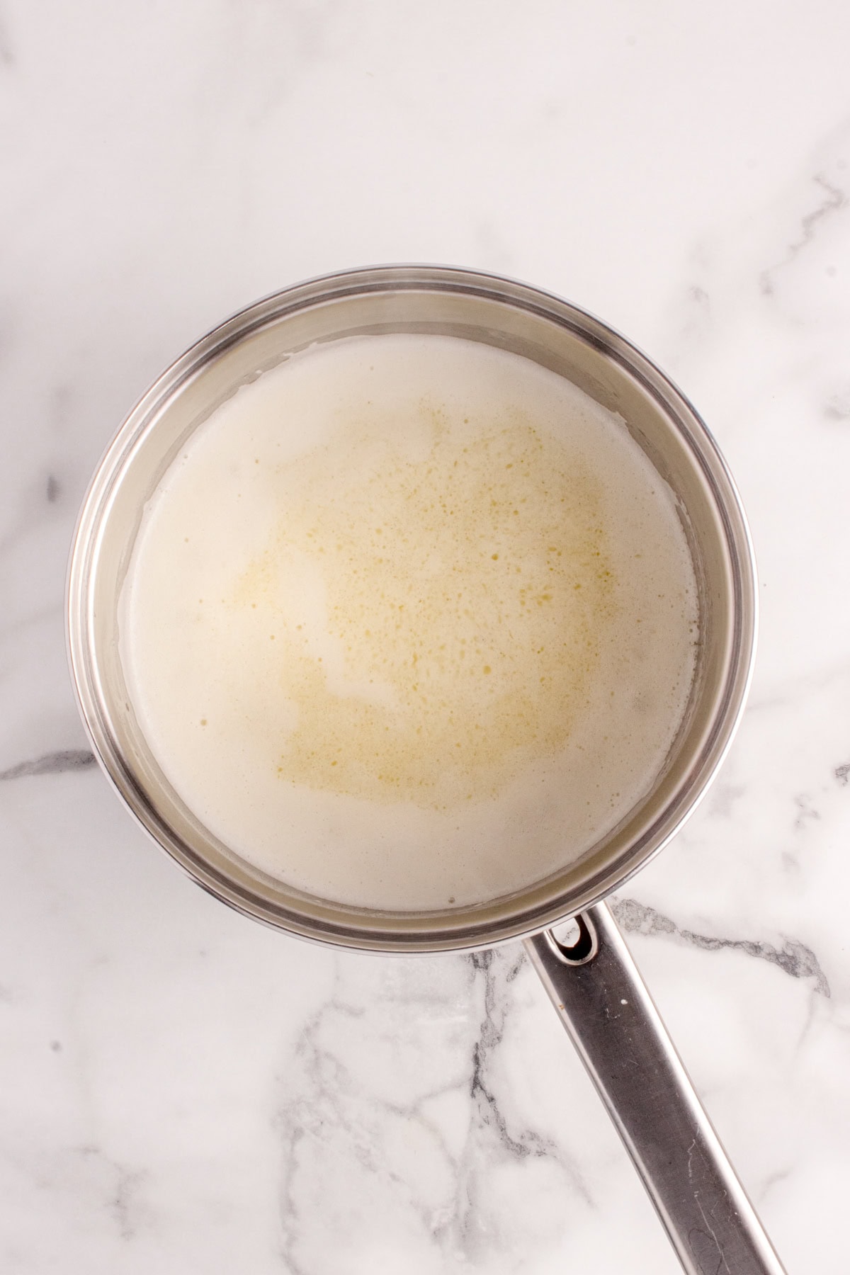 Foam on top of butter. 