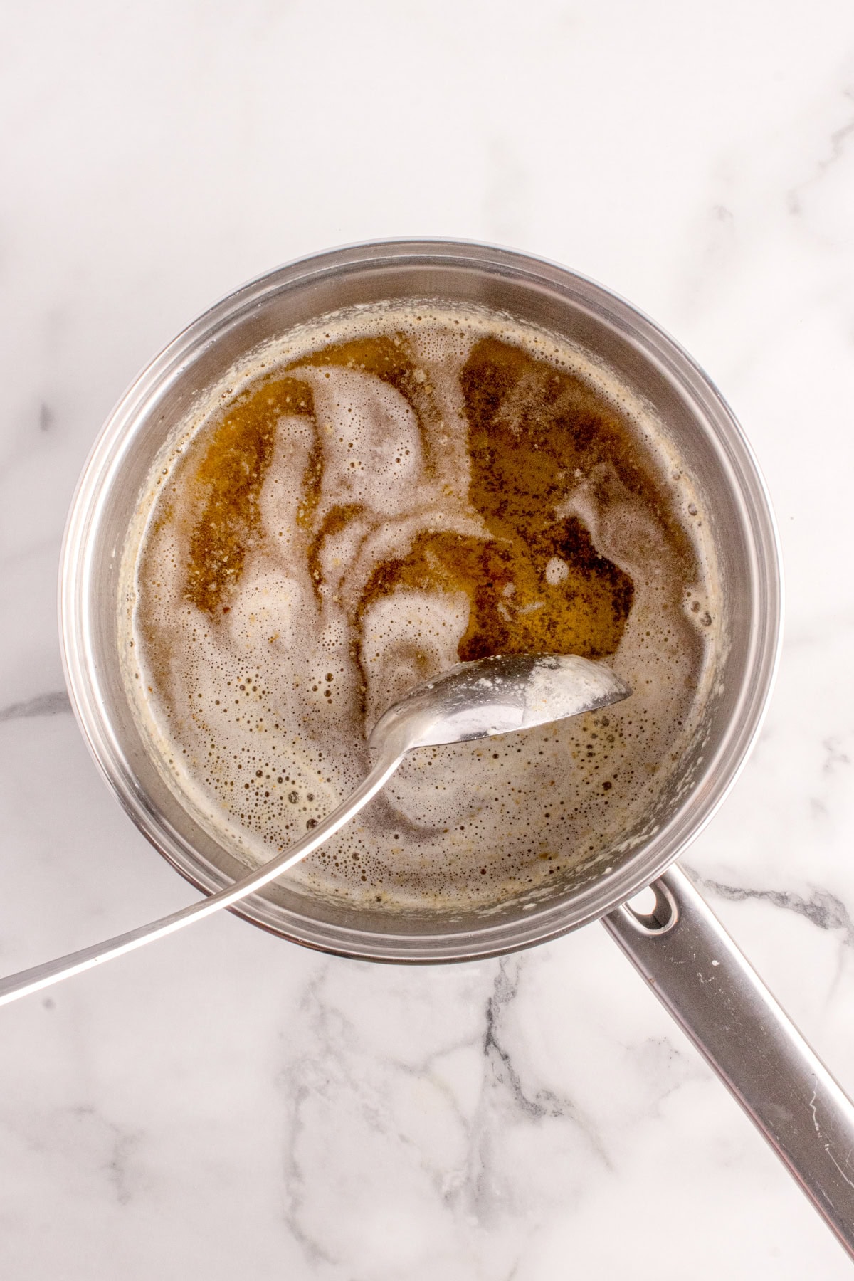 Skimming off more foam. 