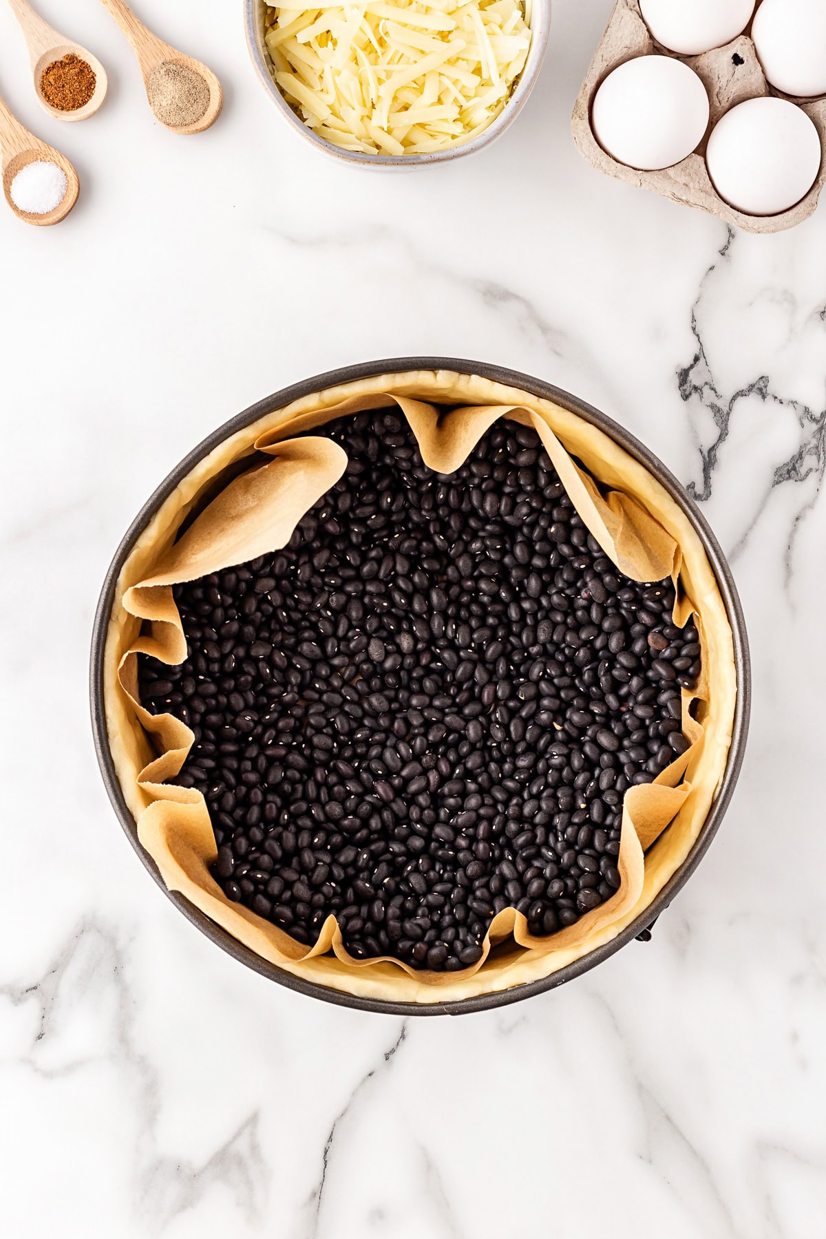 Beans added as pie weights to dough. 