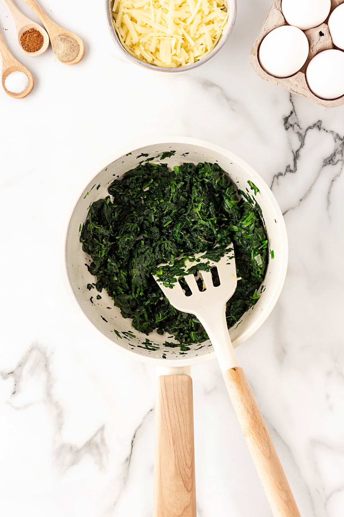 Frozen spinach in a pan. 
