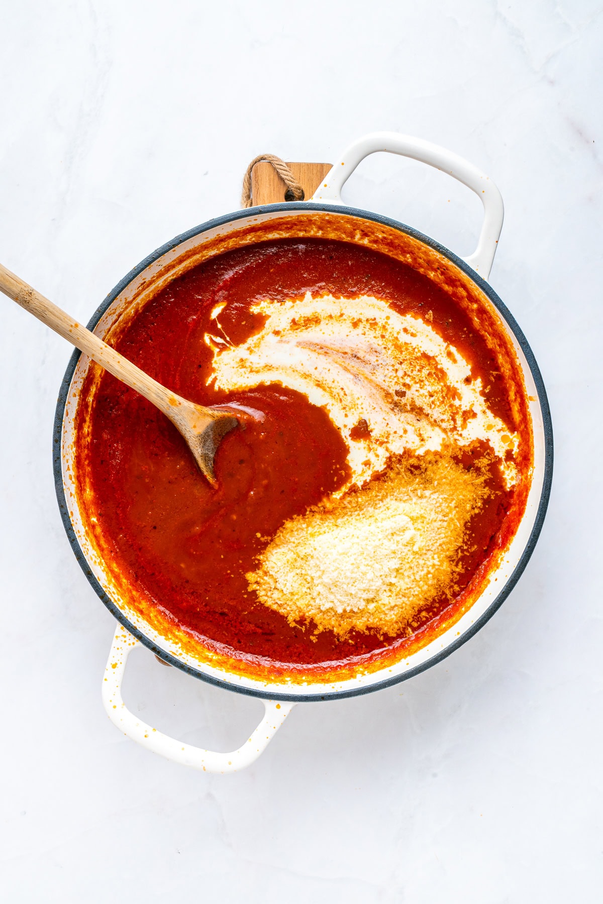 Mix in heavy cream and grated parmesan.