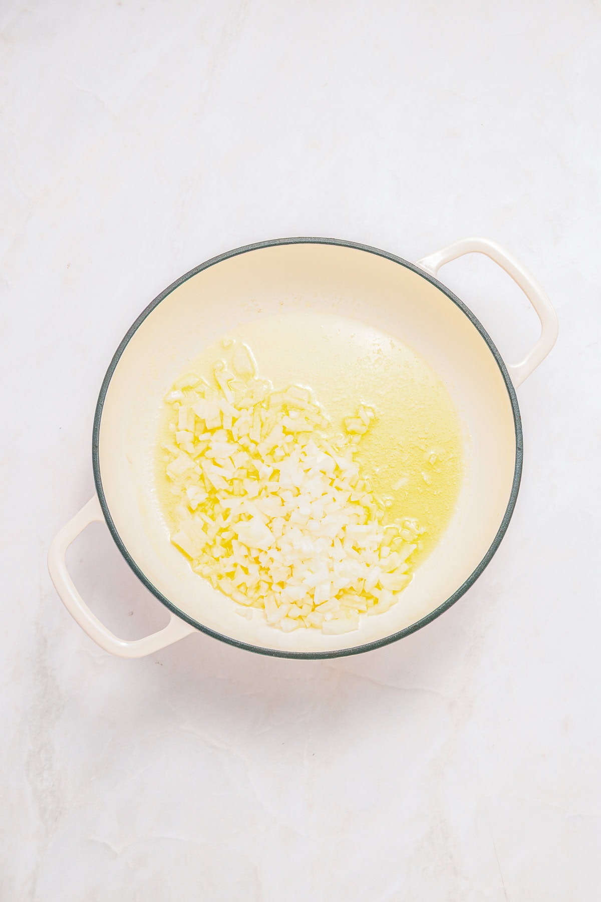 Sauteing onion in butter and olive oil.