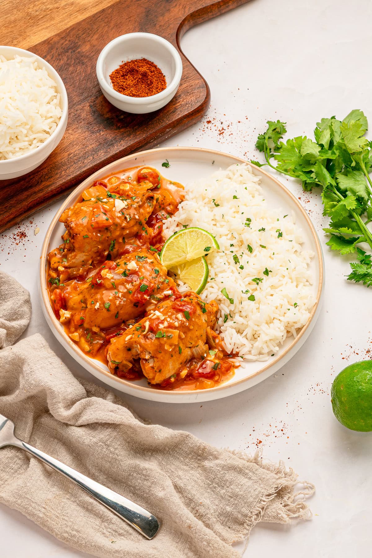 Skillet Chicken Thighs plated with rice. 