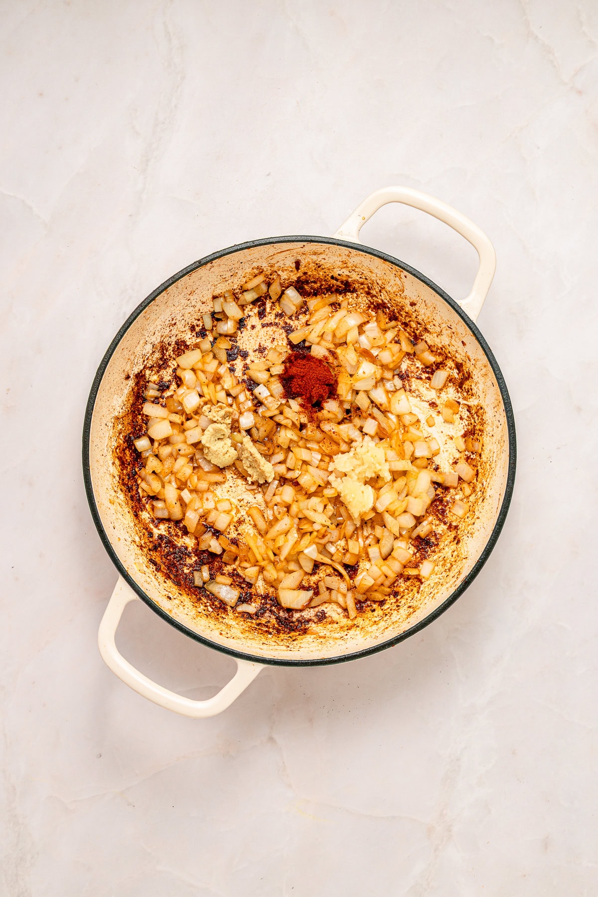 Adding garlic, ginger and seasonings.