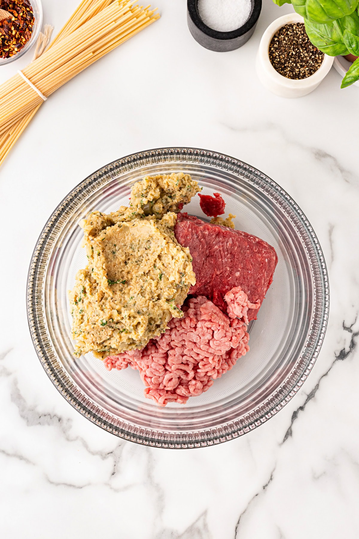 Bread crumb mixture added to meat. 