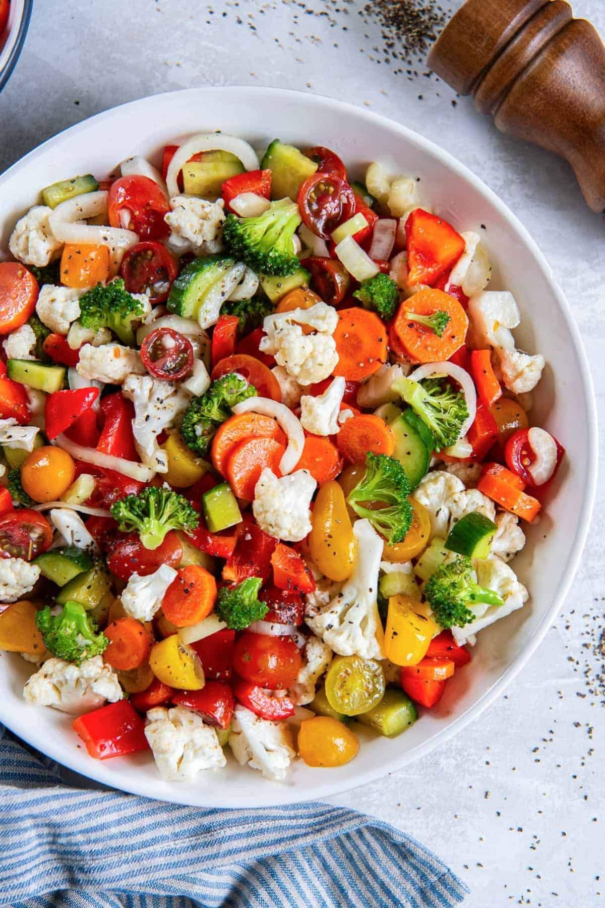 Bowl full of marinated vegetable blend.