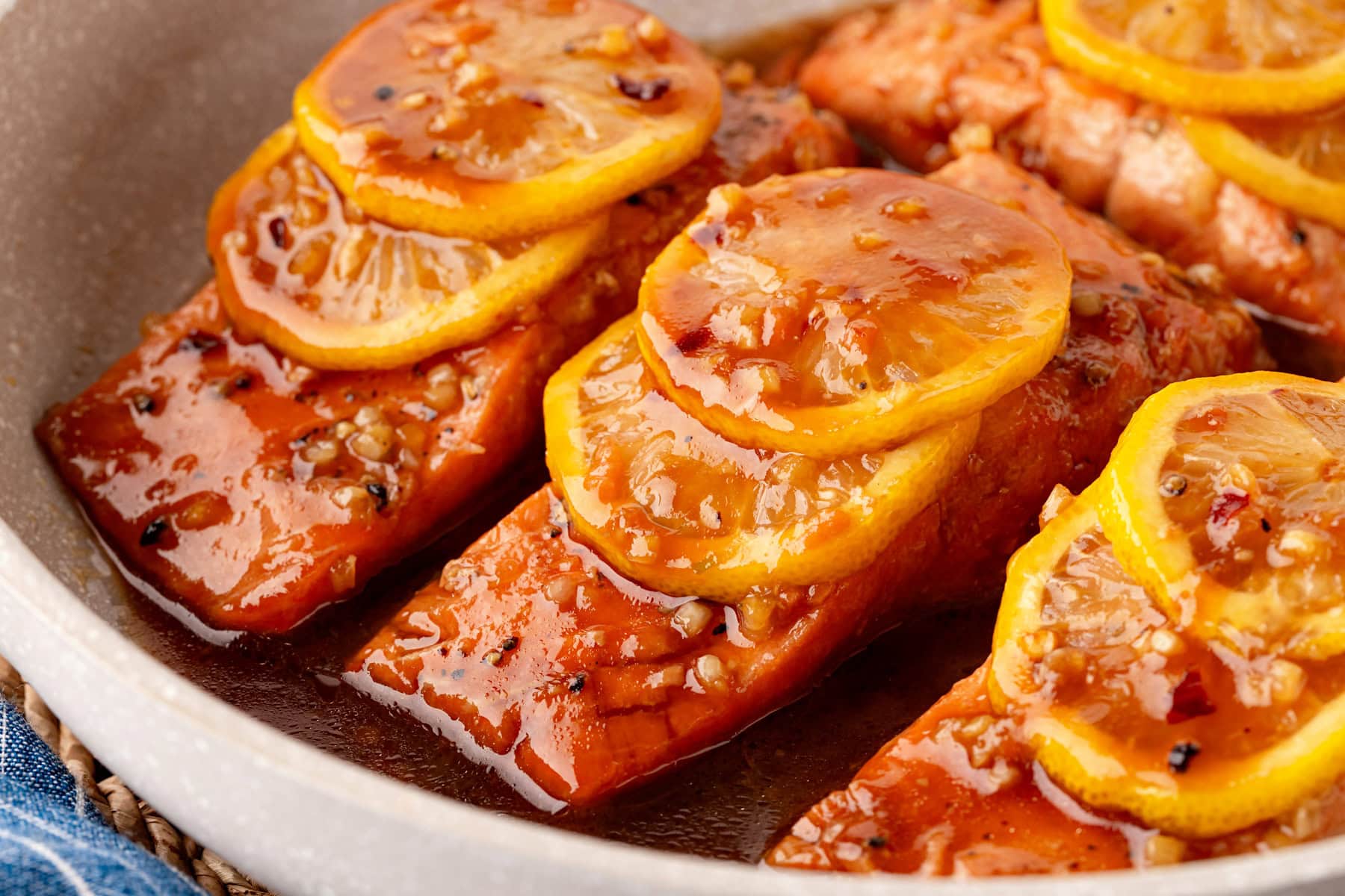 Lemon slices over top of steelhead trout. 