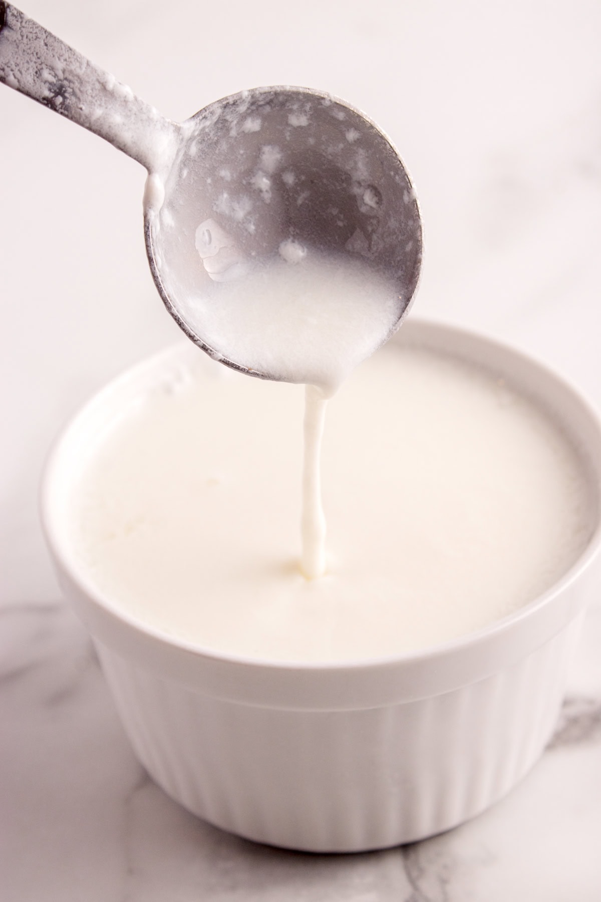 Curds forming on spoon.