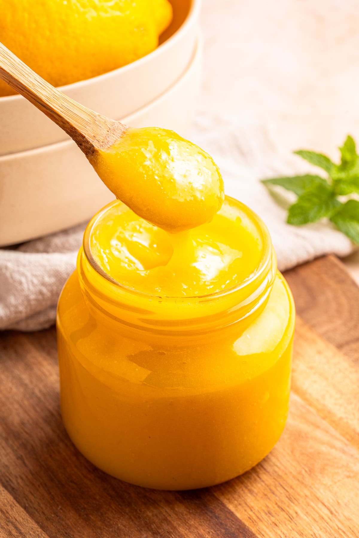 Silky lemon curd on a spoon.
