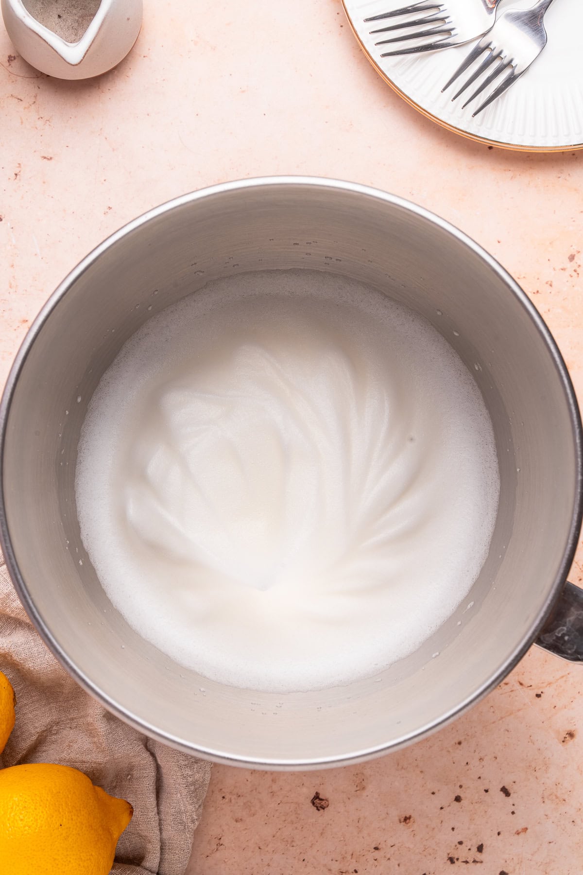 Whipping egg whites to soft peaks.