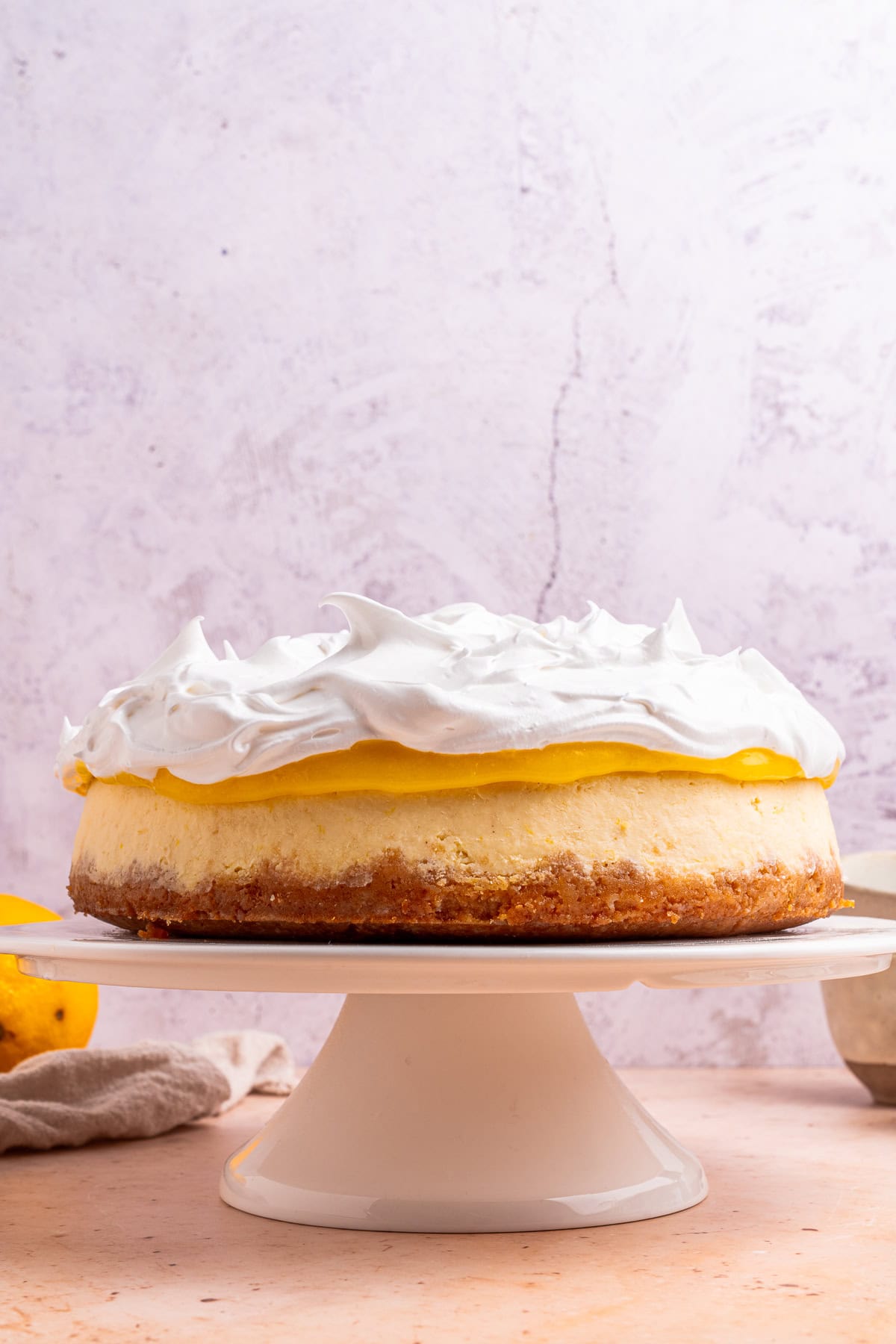 Topping the cheesecake with Italian meringue.