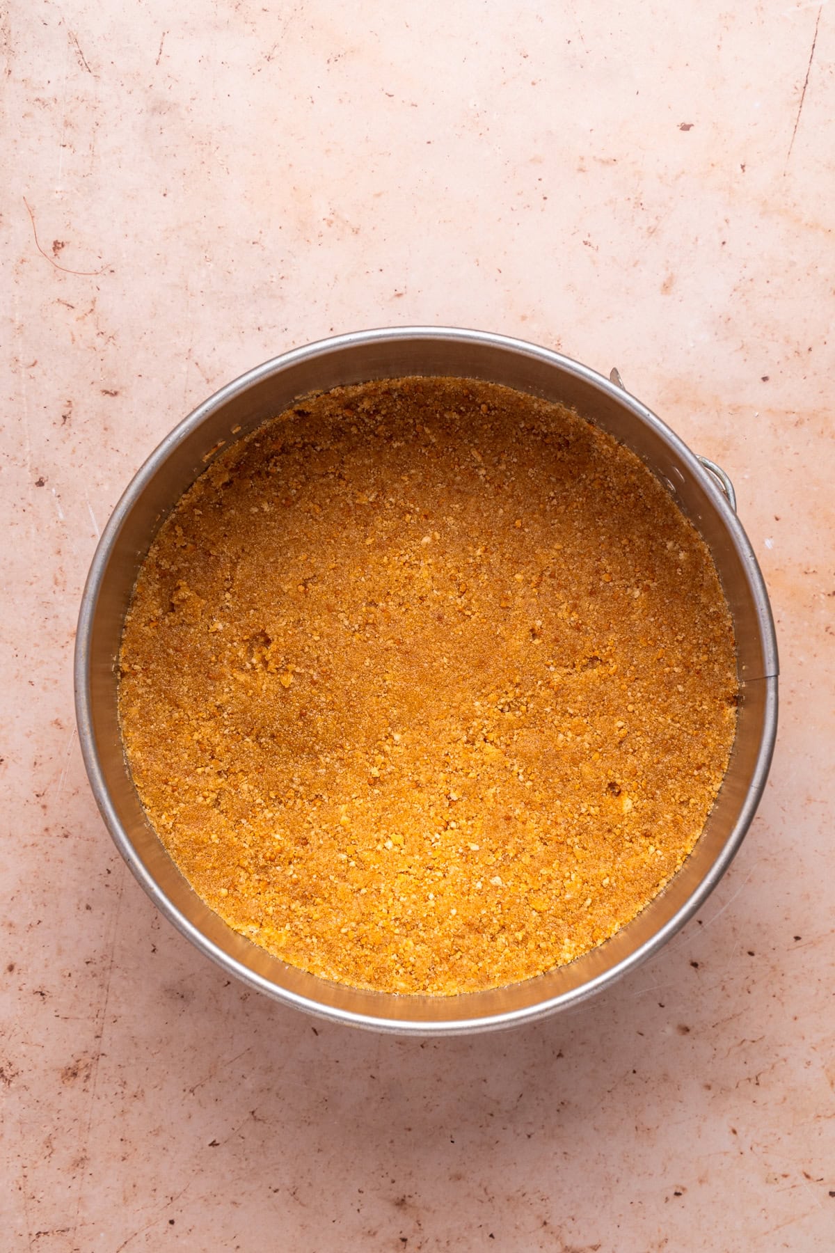 Pressing down the crust layer.