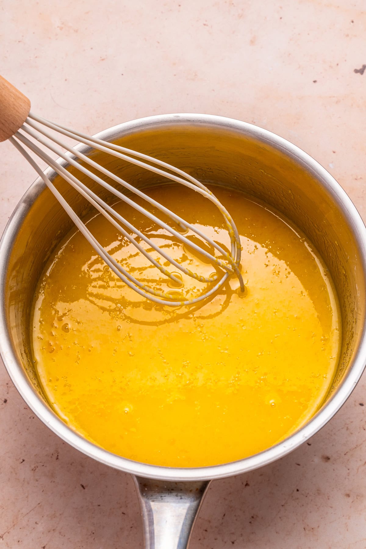 Adding lemon juice, zest, and egg yolks.