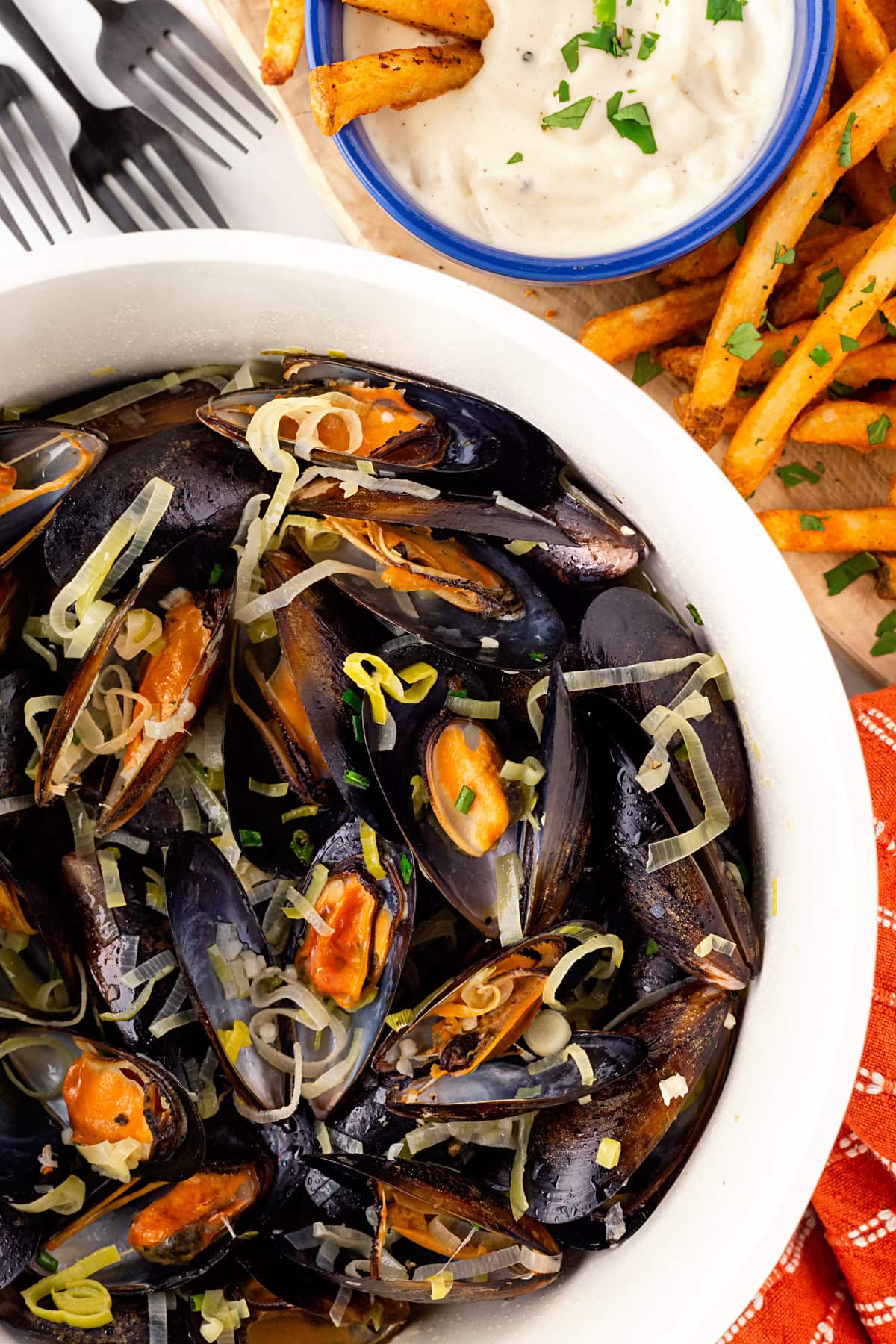 Pot of Mussels in White Wine Sauce with fries and aioli. 