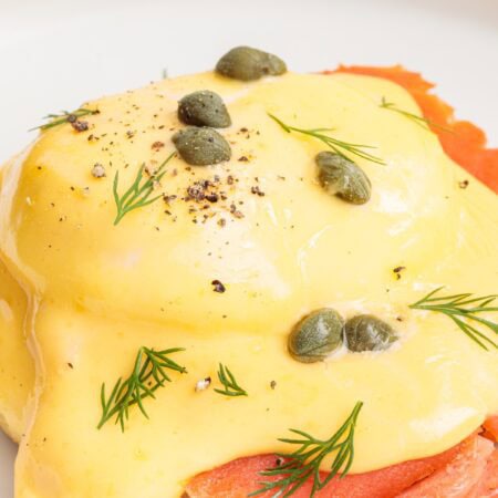 Single Smoked Salmon Eggs Benedict on a plate.