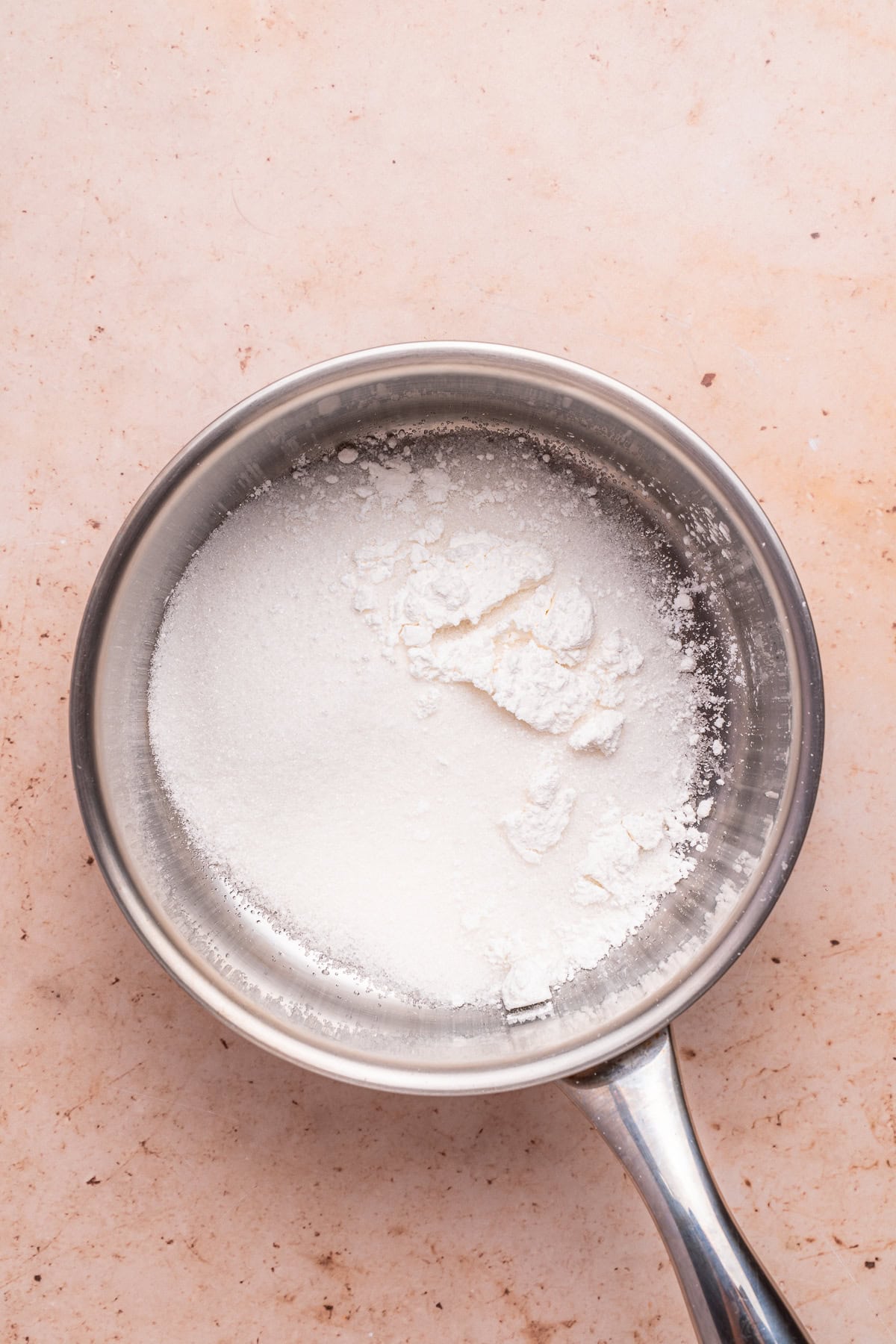 Mixing cornstarch and sugar.