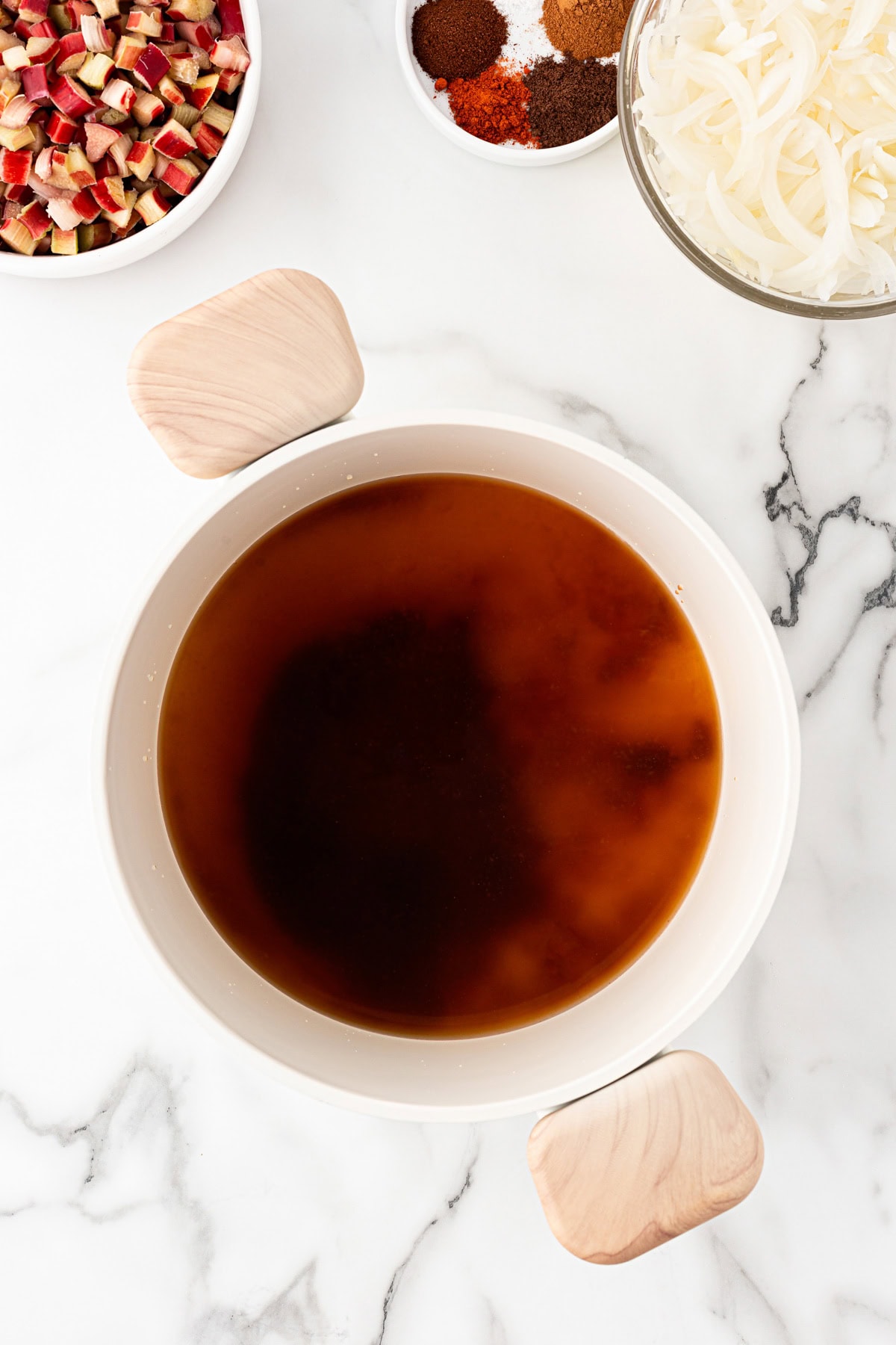 Sugar and vinegar over medium heat.