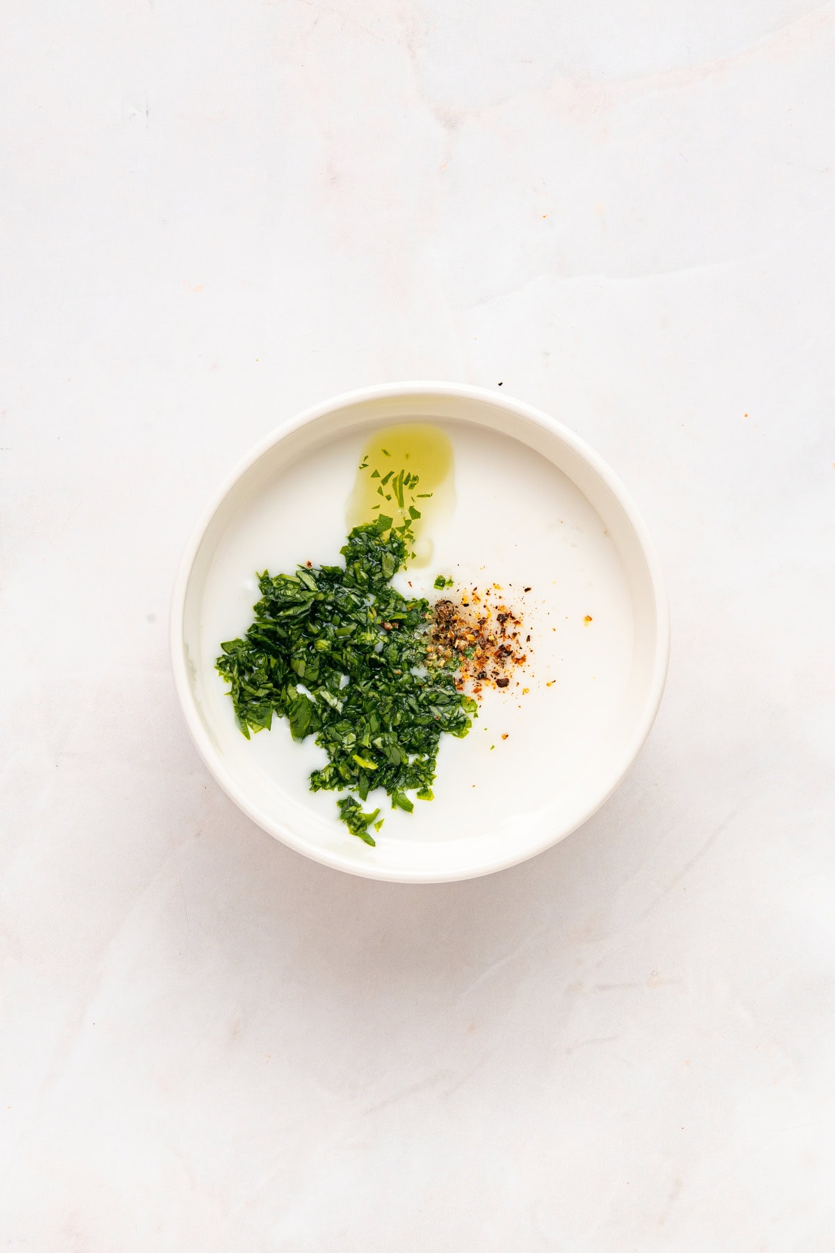 Mixing dressing ingredients.