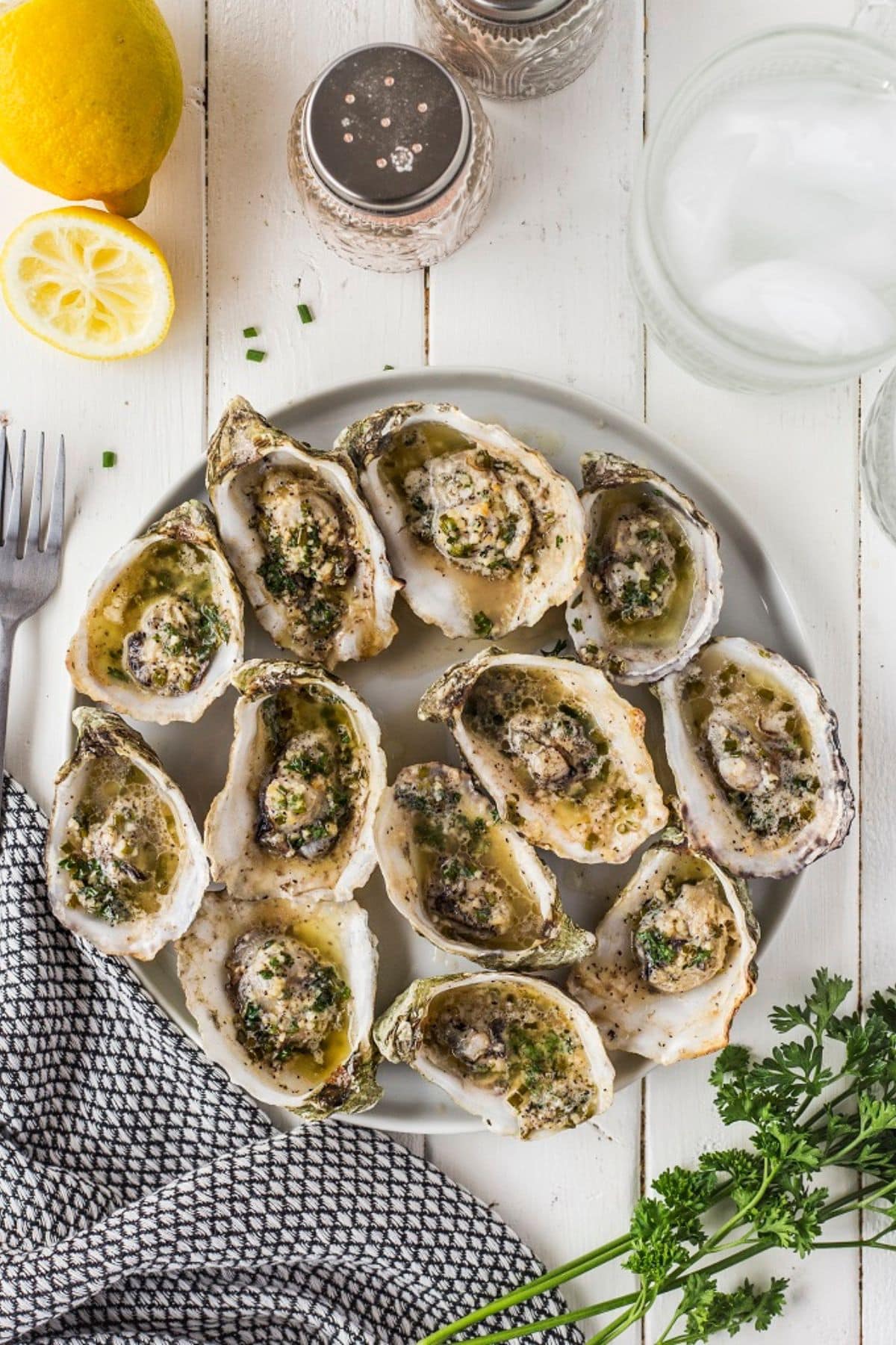 Grilled oysters on a serving platter.