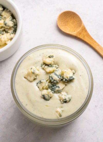 Overhead of blue cheese dressing in a jar.