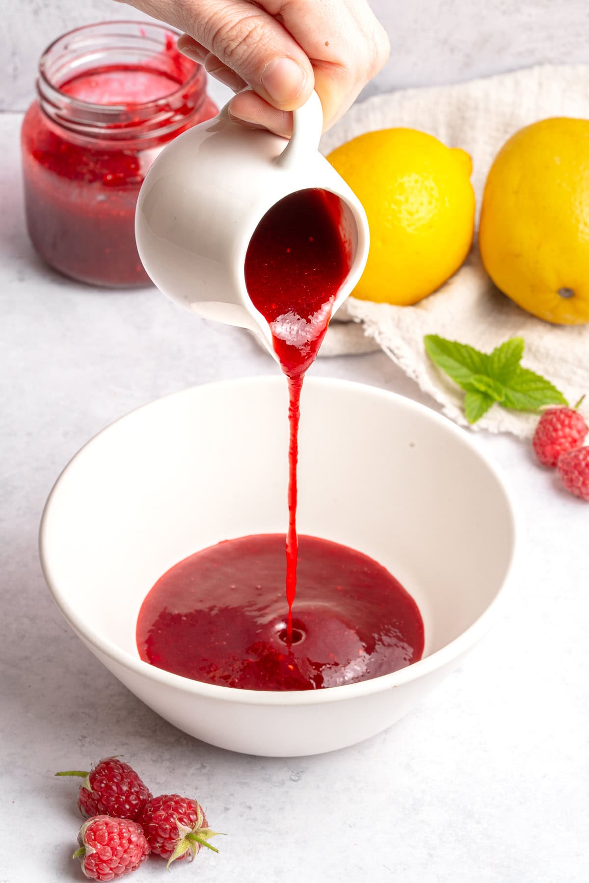 Pouring raspberry coulis.