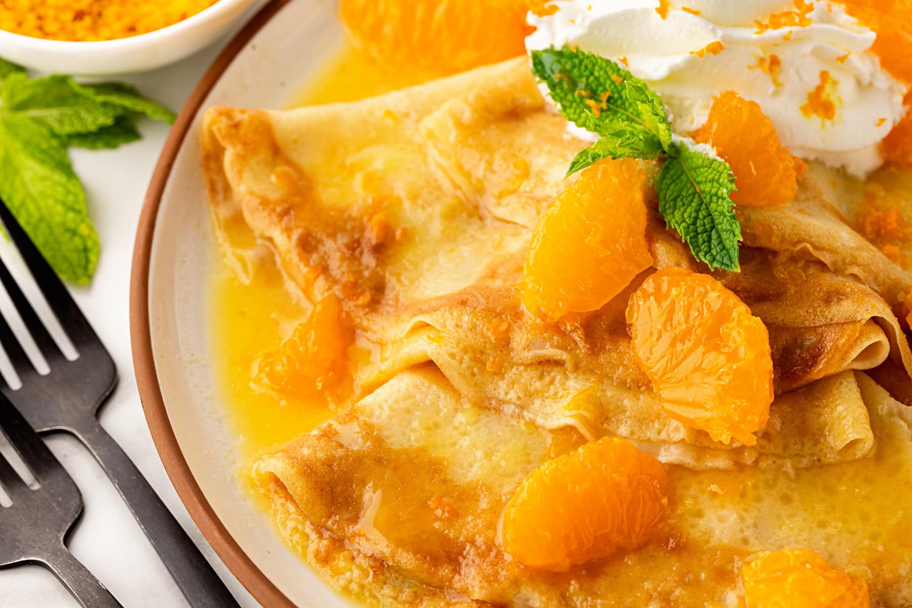 Close-up overhead of Crepes Suzette.