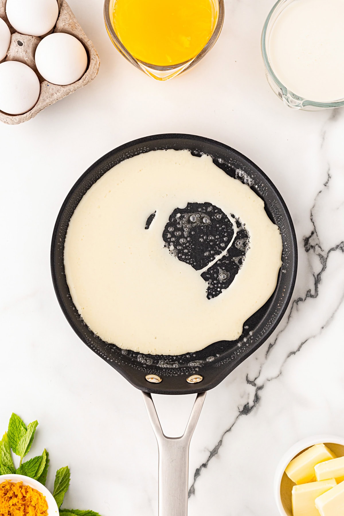 Starting the crepe in the pan.