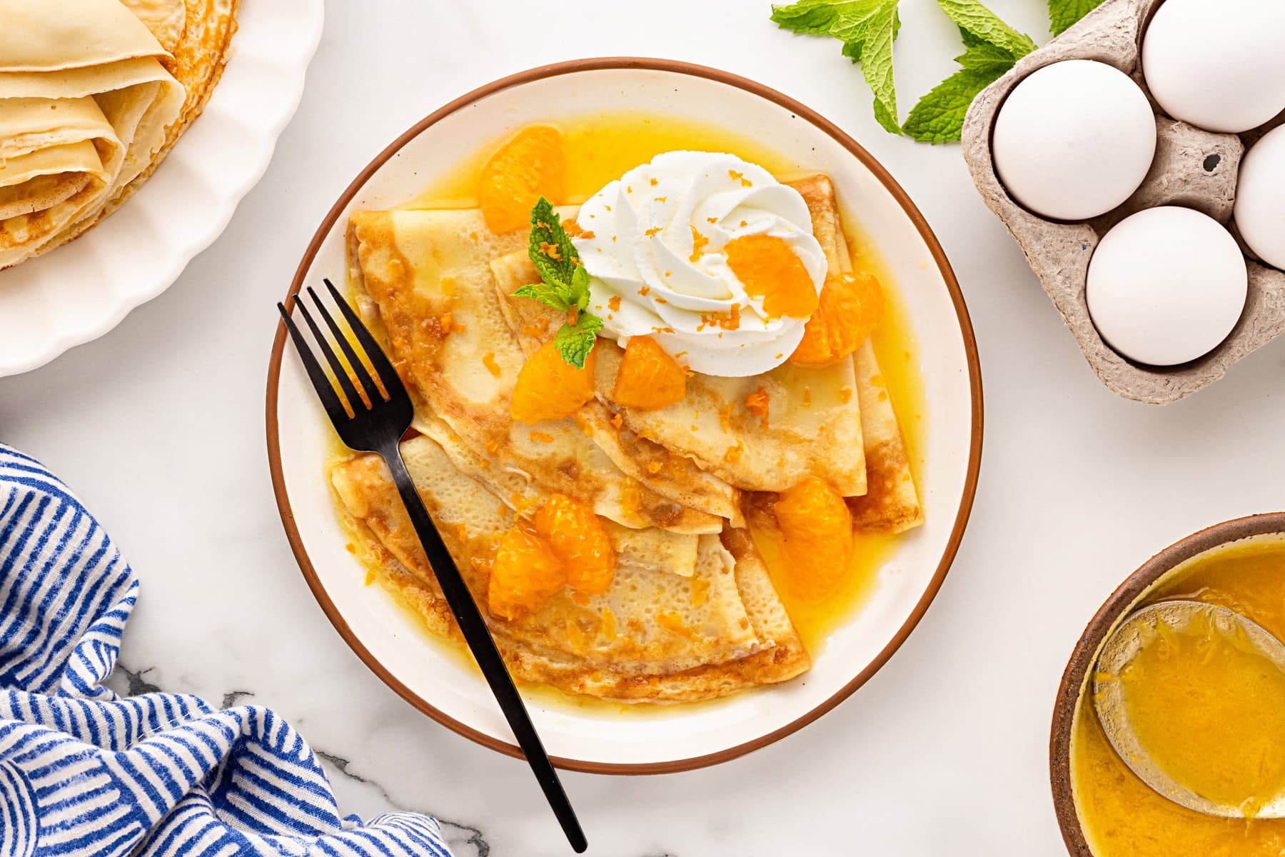 Overhead of plate of Crepes Suzette.