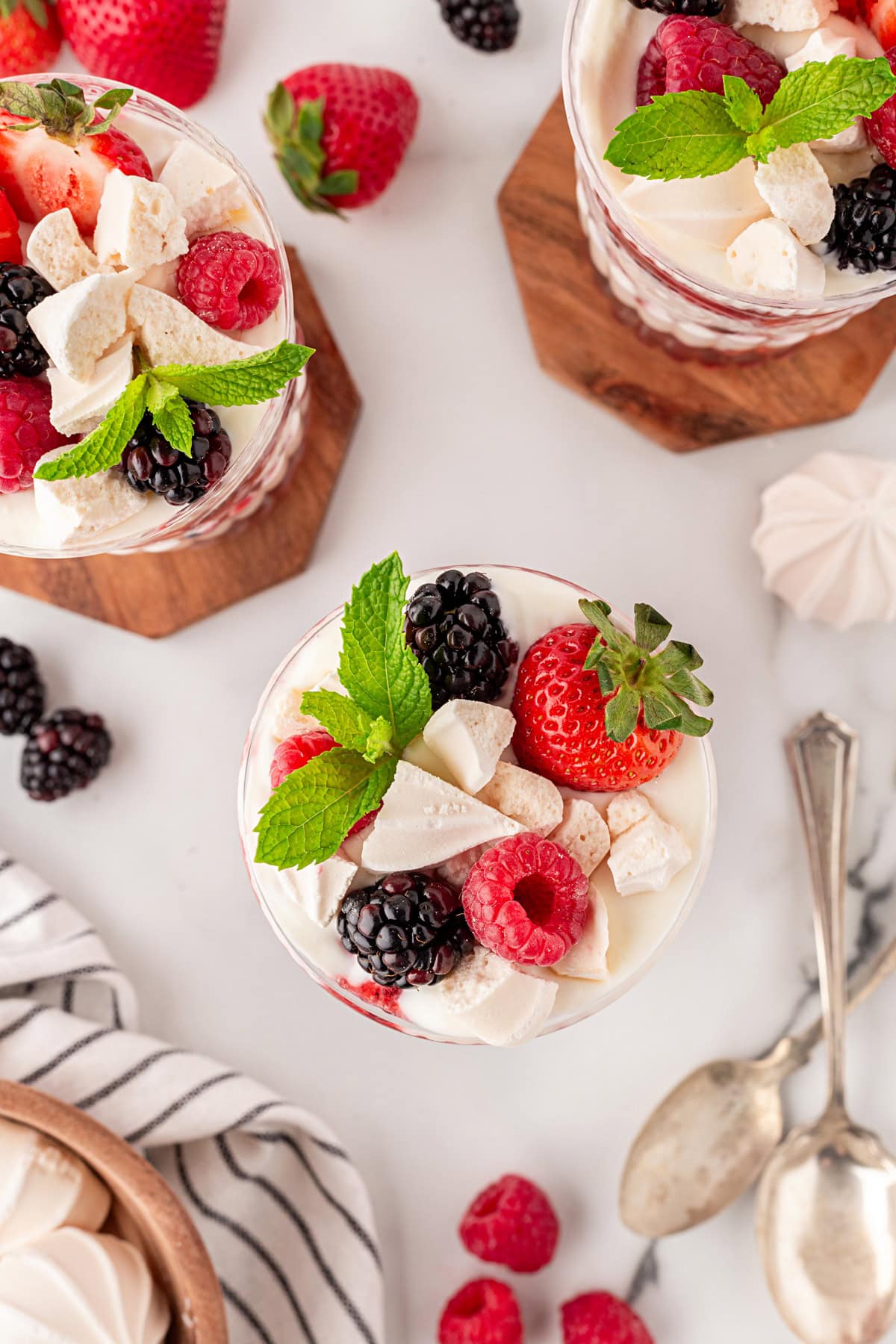 Topped with fresh berries, meringue and mint. 