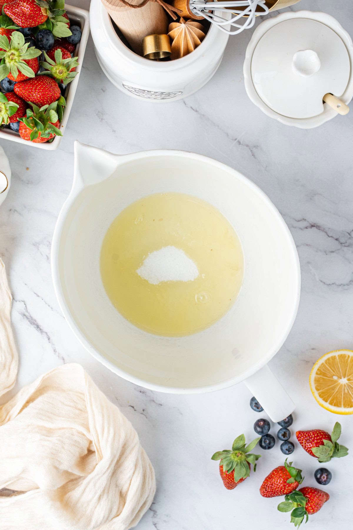 Sugar and lemon juice added to the egg whites.