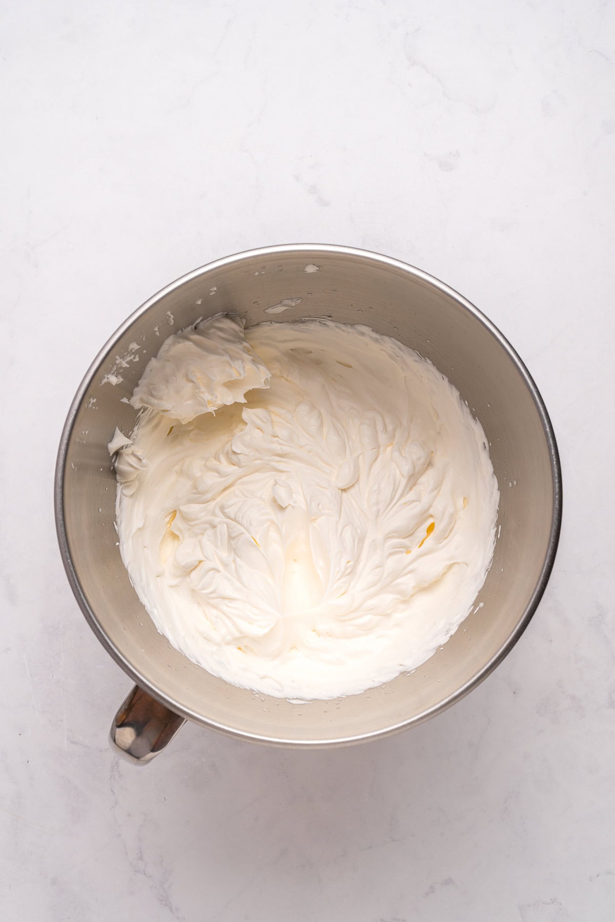 Whipped cream in a mixing bowl.