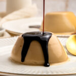 Pouring syrup on panna cotta.