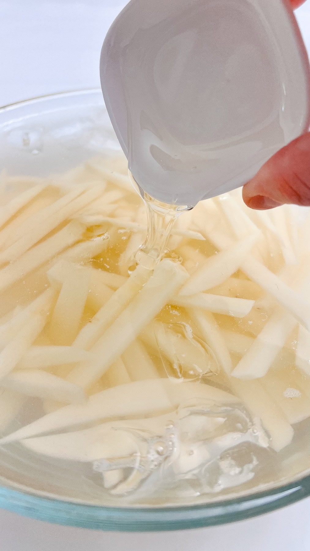 Adding corn syrup. 