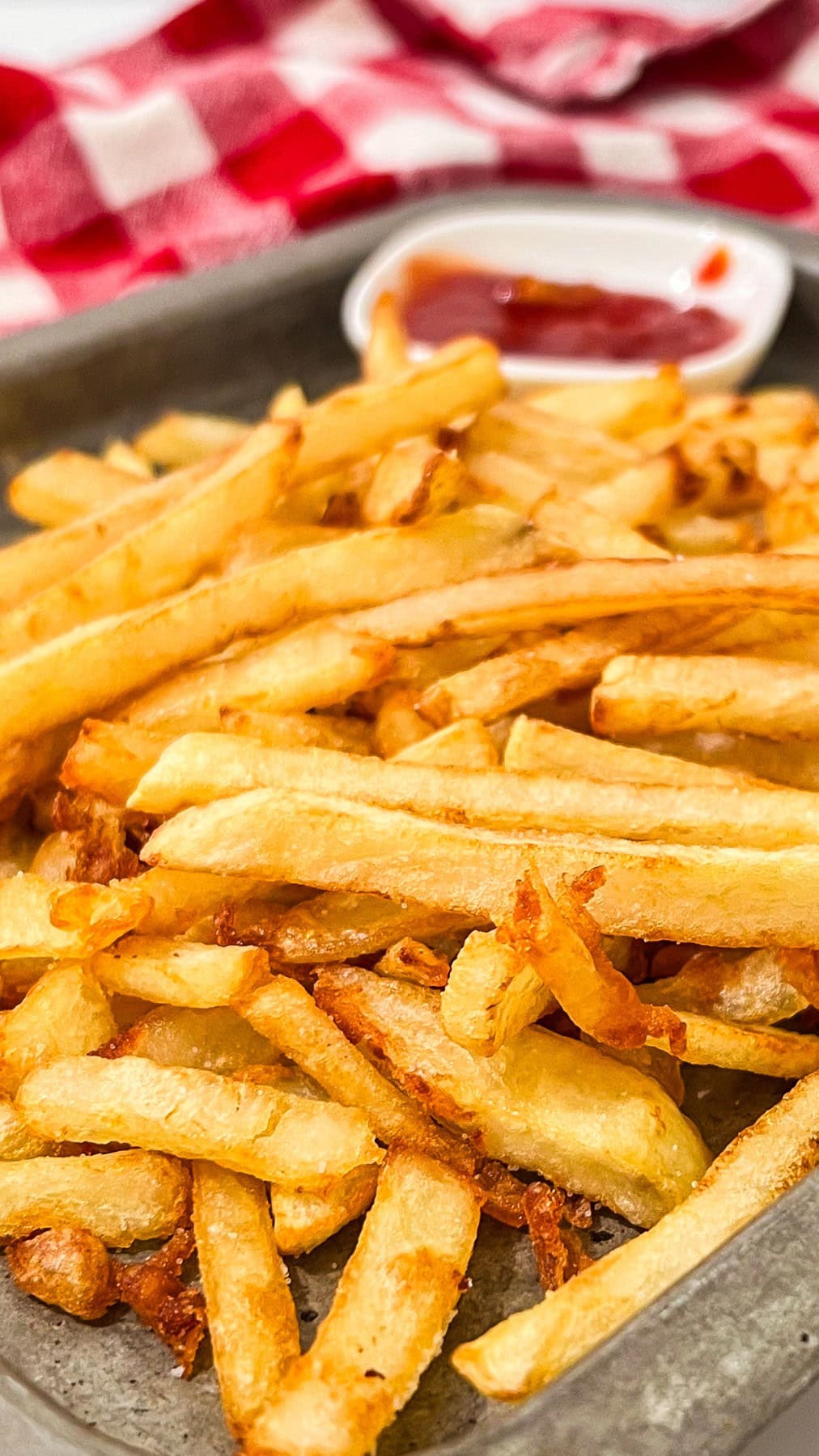 Homemade fries with ketchup. 