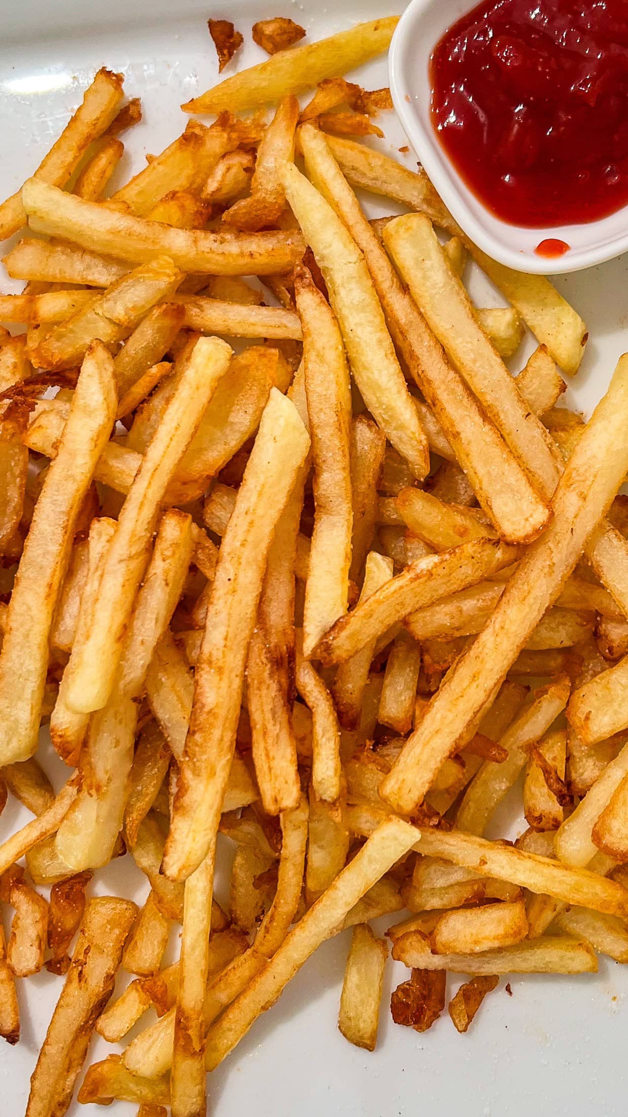 Crispy homemade fries with ketchup. 