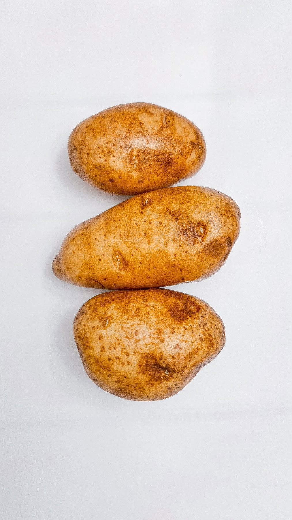 Washed russet potatoes. 